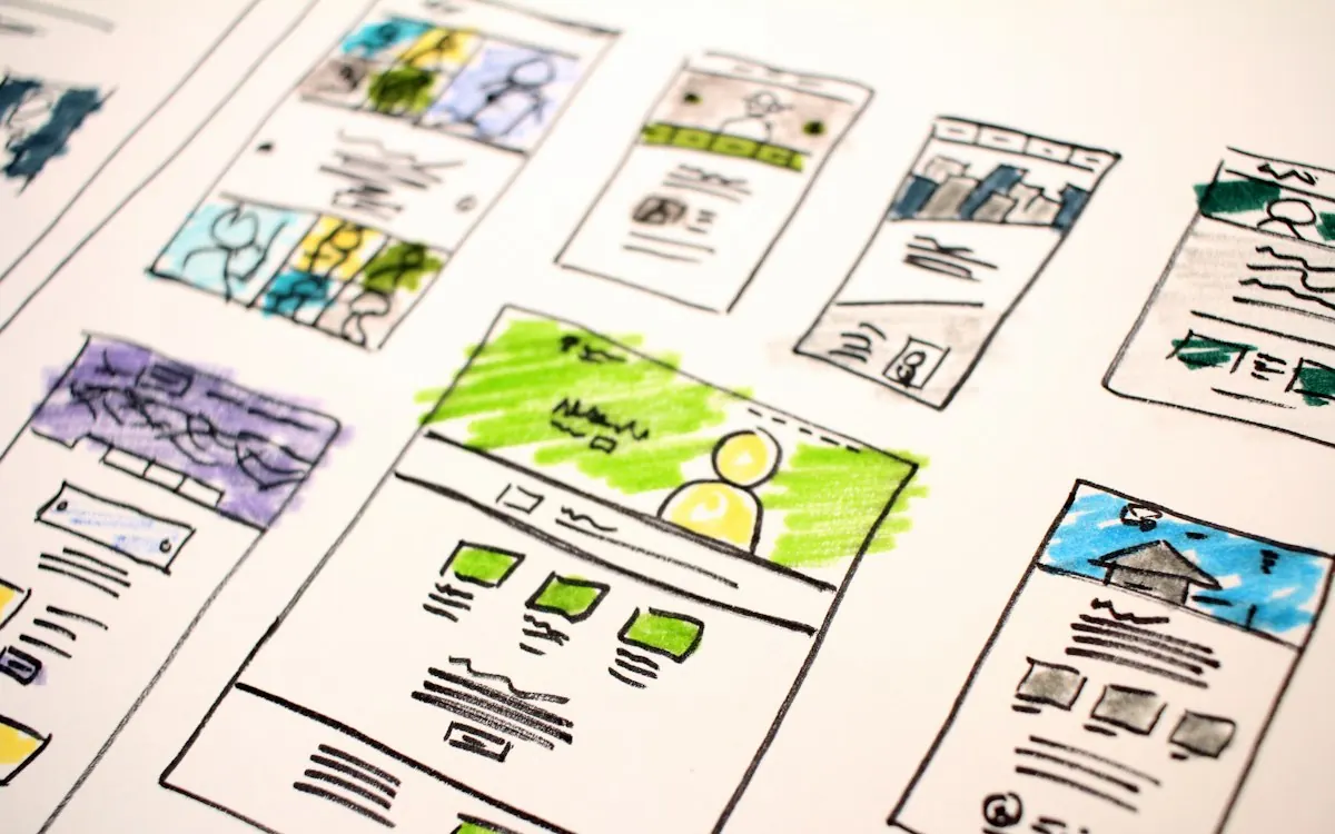 Website wireframes laid out on a desk