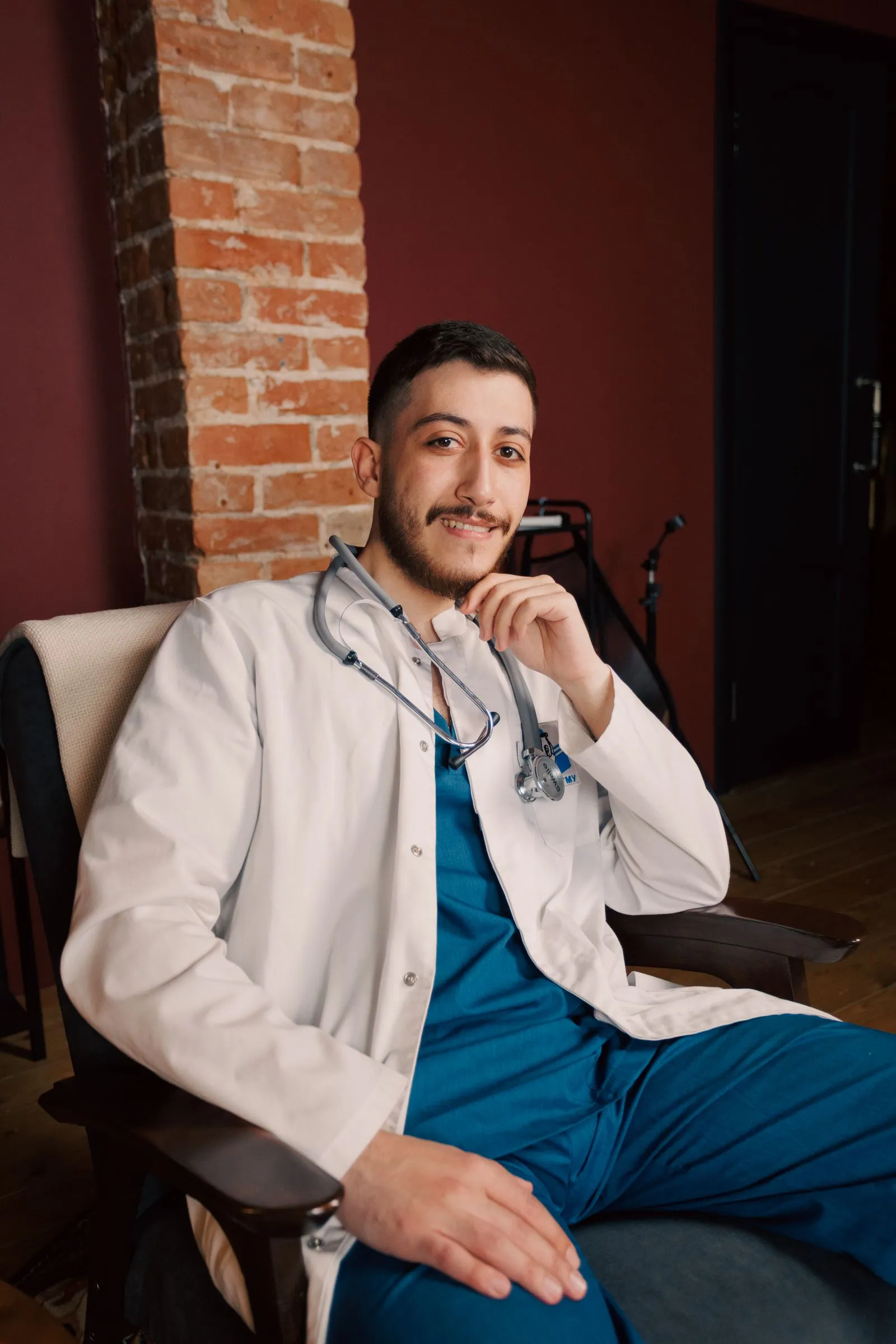 Portrait of Dr. Marcus Reid seated in a white coat
