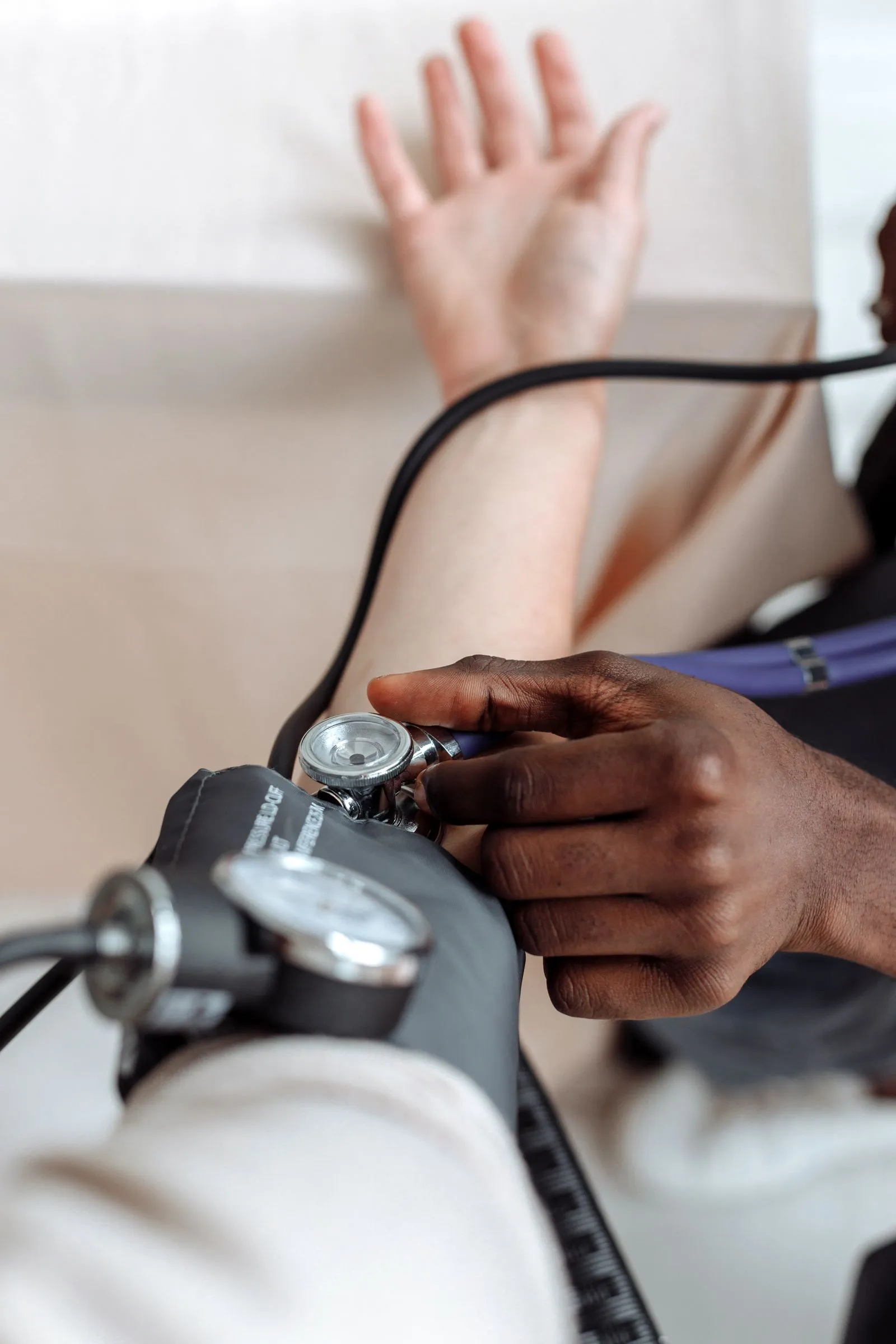 Blood pressure being measured with a cuff at home