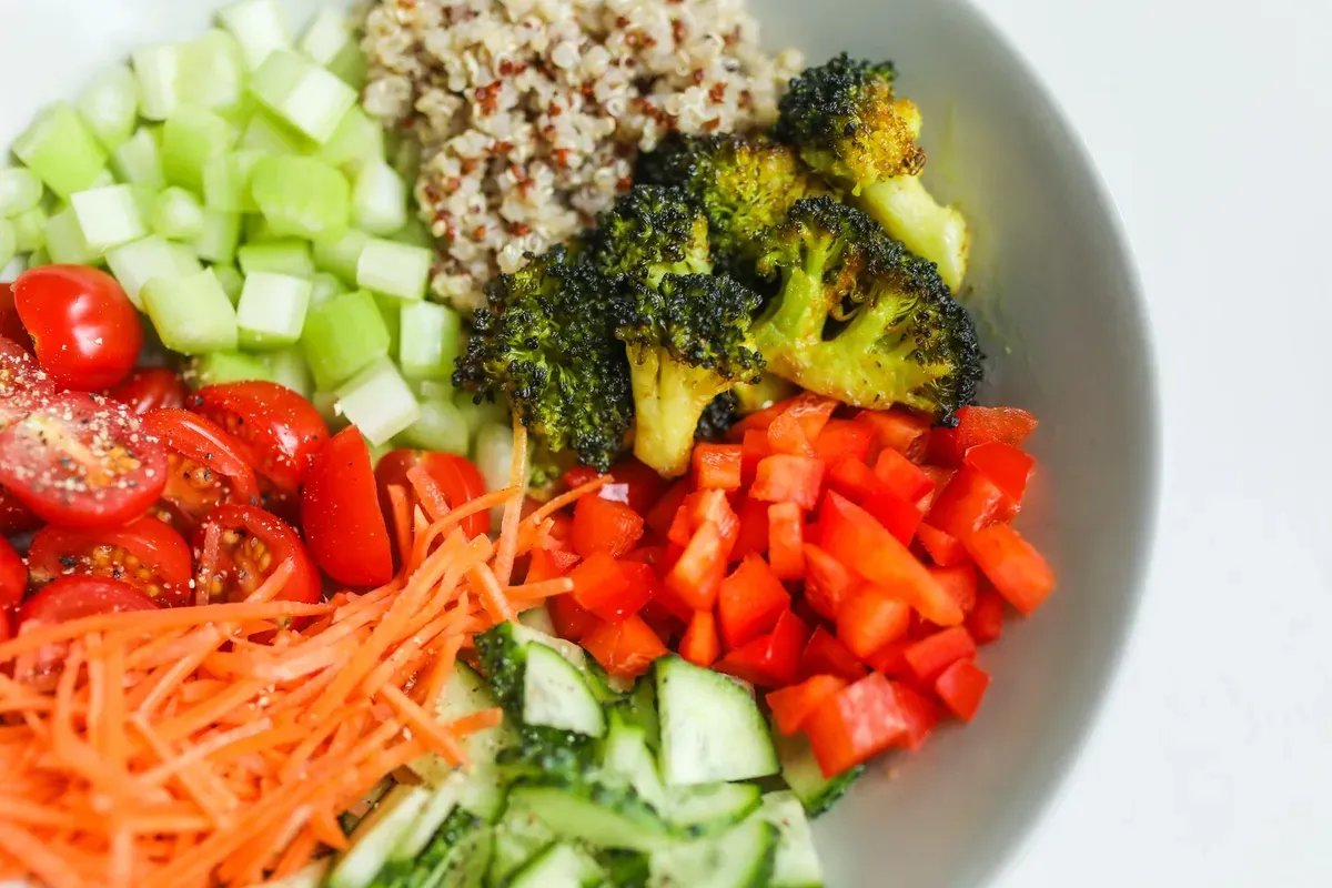 Nutritious salad bowl with fresh vegetables and quinoa